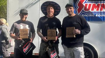 Jody Miller and Ray Kochin standing with their Pine Mountain HillClimb awards