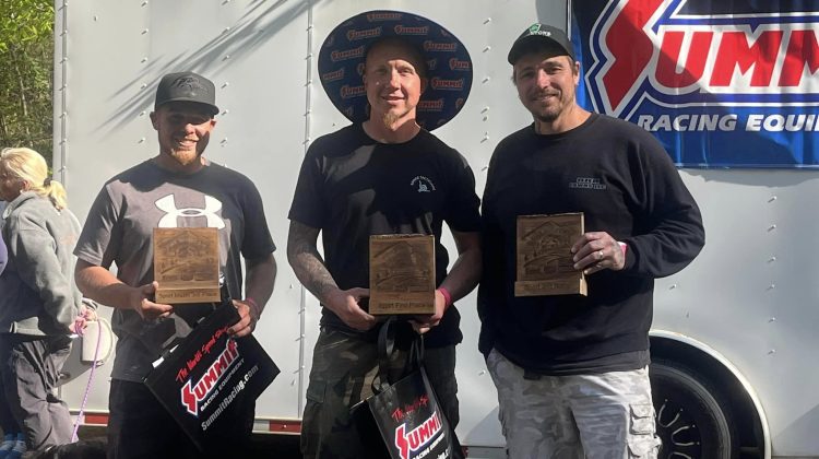 Jody Miller and Ray Kochin standing with their Pine Mountain HillClimb awards
